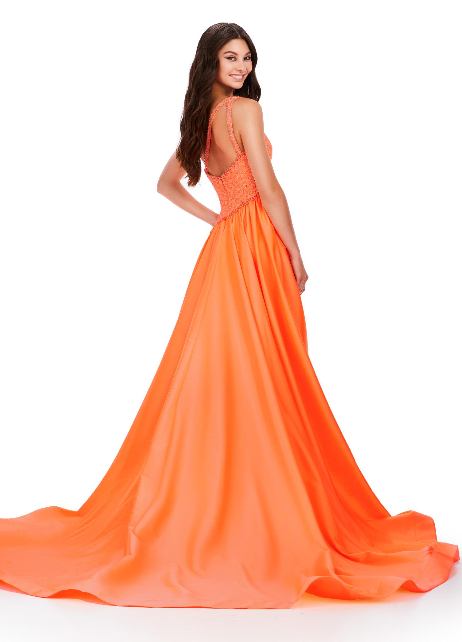 Back view. ASHLEYlauren 11456 coral one shoulder gown with beaded bustier, open back, and dramatic taffeta skirt and overskirt