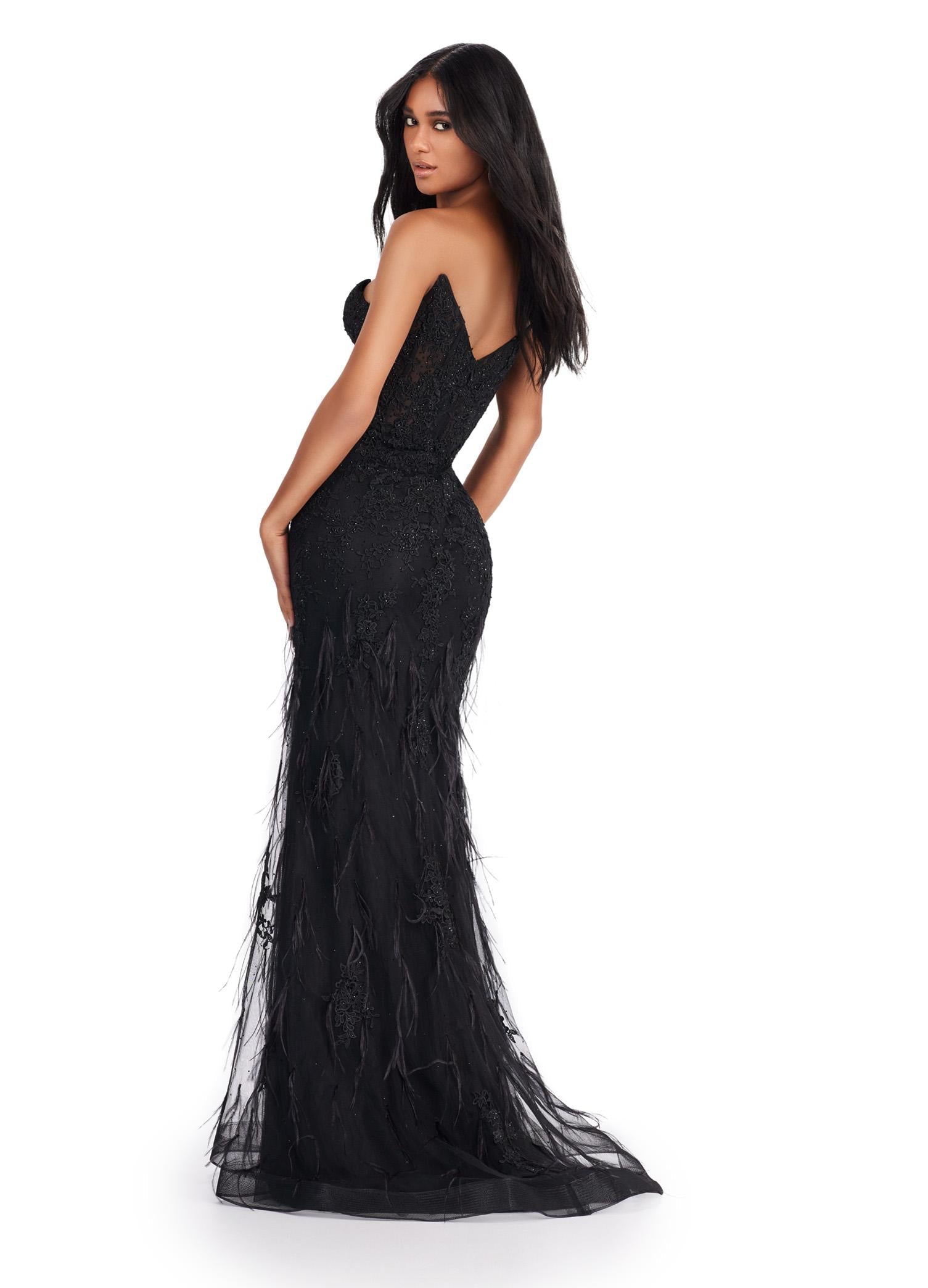 Back view. ASHLEYlauren 11483 black strapless lace gown with sweetheart neckline, feather detailing, corset bodice, and V-back