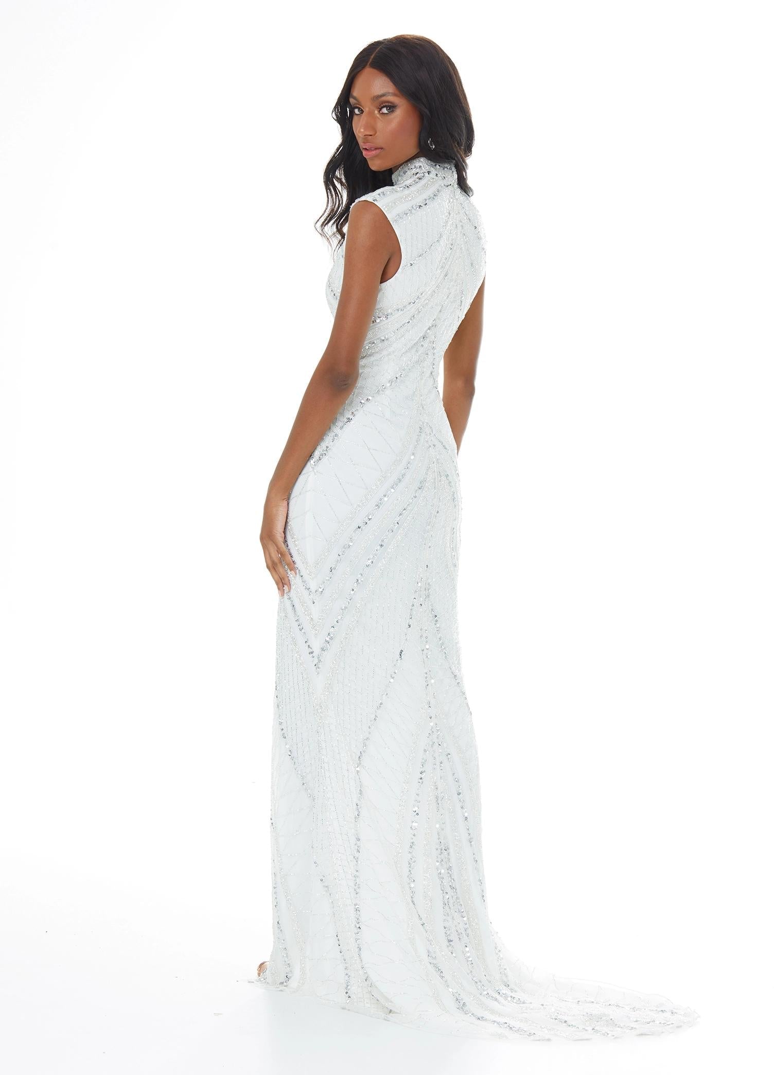 Back view. ASHLEYlauren 1674 Silver/Ivory fully beaded gown with high neck, cap sleeves, centre slit, and geometric detailing