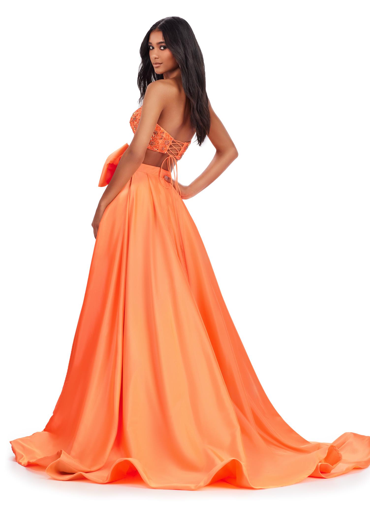 Back view. Coral ASHLEYlauren 11650 Two-Piece Ball Gown with Intricately Beaded Strapless Bustier, A-Line Taffeta Skirt, and Statement Oversized Bow Detail