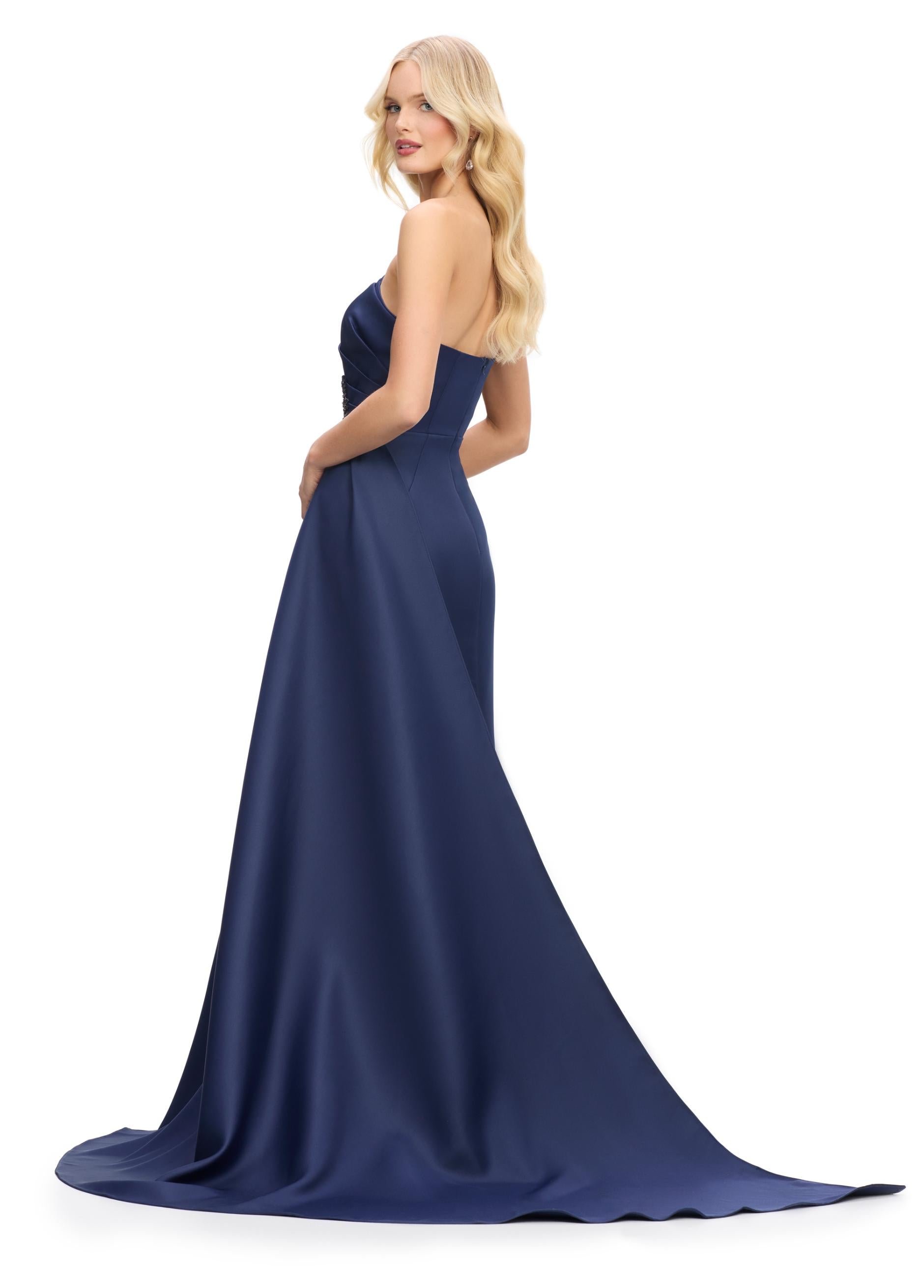 Back view. Navy ASHLEYlauren 11700 Elegant Strapless Gown with Asymmetrical Bustier, Sparkling Beaded Details, and Flowing Side Skirt for a Show-Stopping Silhouette
