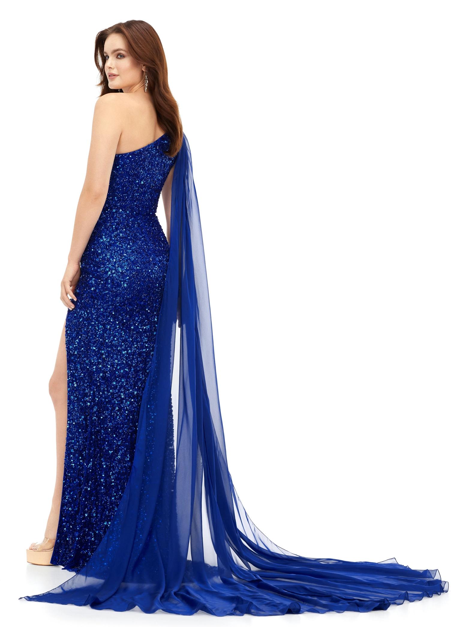 Back view. Royal ASHLEYlauren 11371 dazzling one shoulder sequin gown featuring a fully hand-beaded design, a detachable chiffon cape, and a left leg slit, available in vibrant color options for a bold and glamorous statement look.