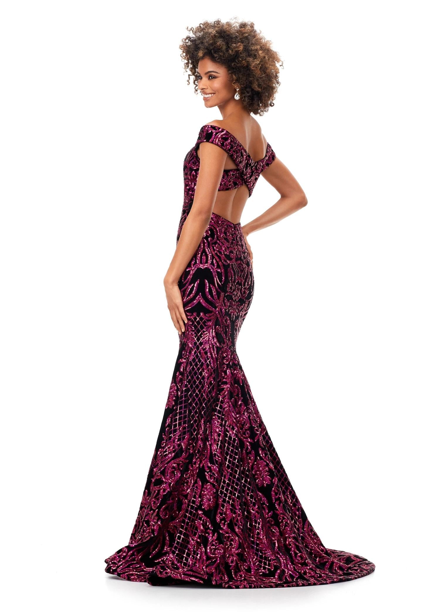 Back view. Ruby Red ASHLEYlauren 11330 elegant off shoulder velvet sequin gown featuring a signature criss-cross back, a fitted silhouette, horsehair hem, and a sweep train for a sophisticated and glamorous look.