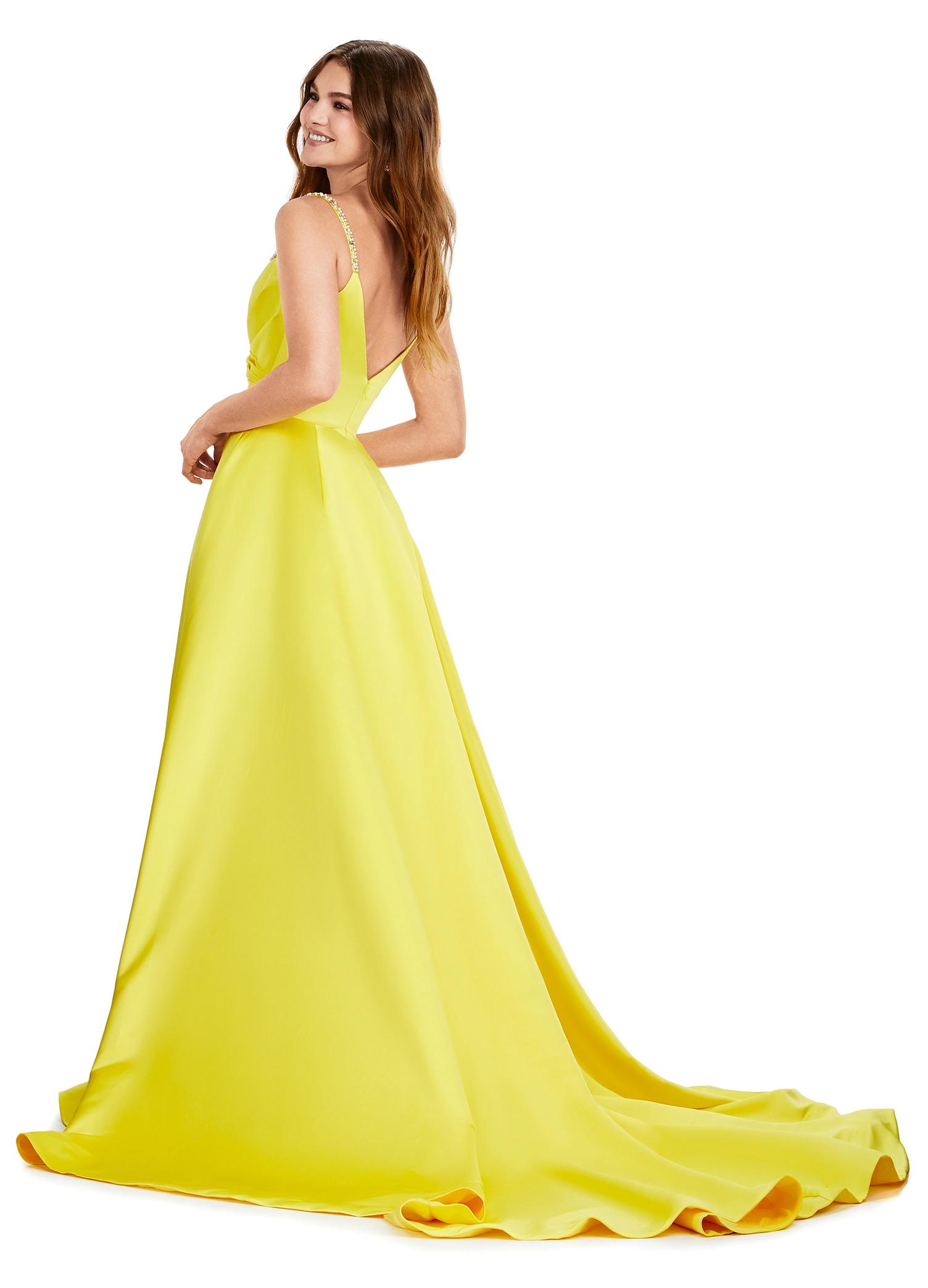 Back view. Yellow ASHLEYlauren 11267 stunning A-line gown featuring delicate spaghetti straps, a sweetheart neckline, eye-catching crystal trim, and asymmetrical ruching on the bustier to accentuate your curves for a glamorous and sophisticated look.