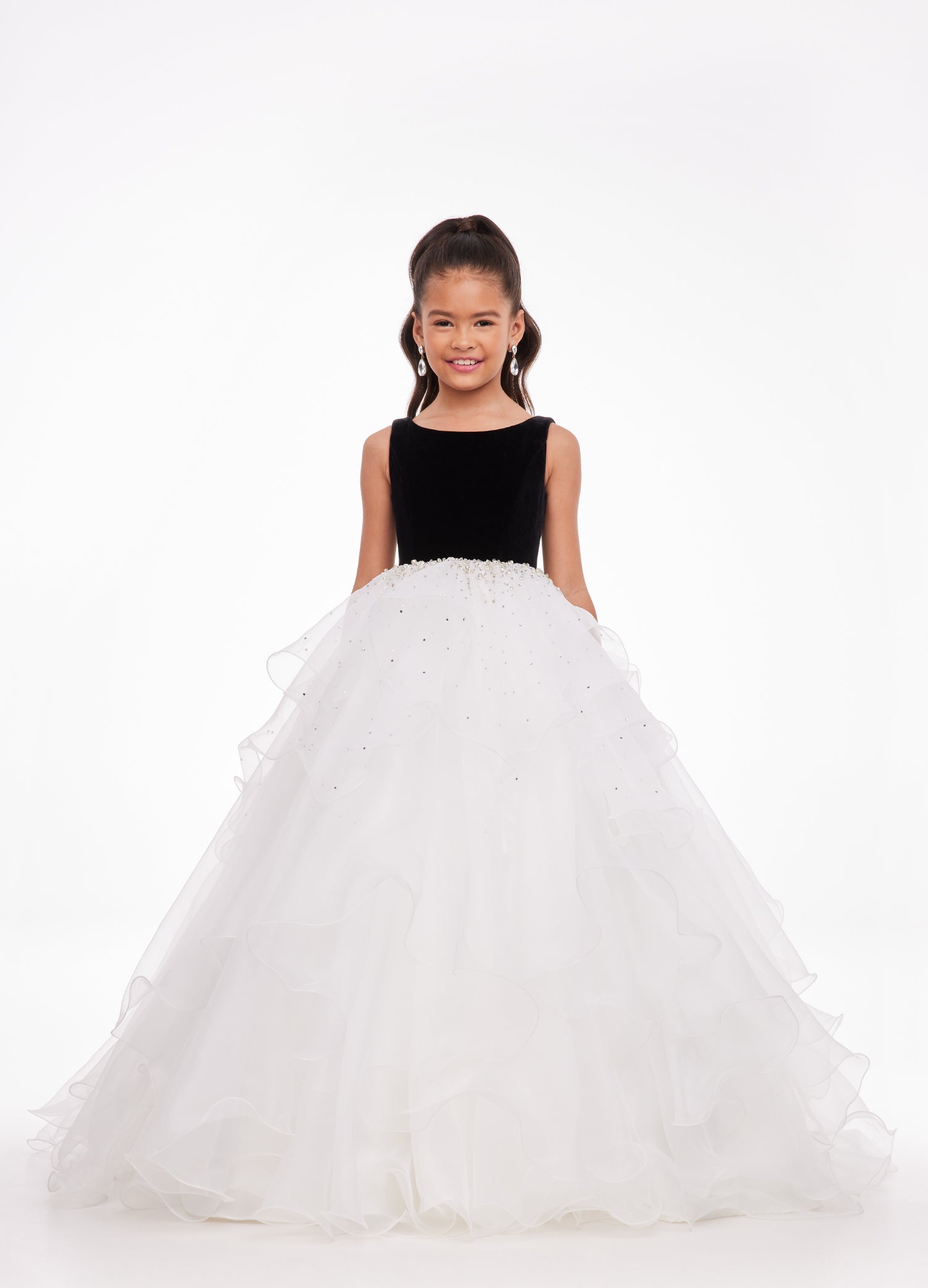 Black/Ivory ASHLEYlauren Kids 8120 elegant ball gown featuring a crew neckline, velvet bustier, beaded waistline, and cascading press-on stone details over a handkerchief organza skirt for a sophisticated and graceful look.
