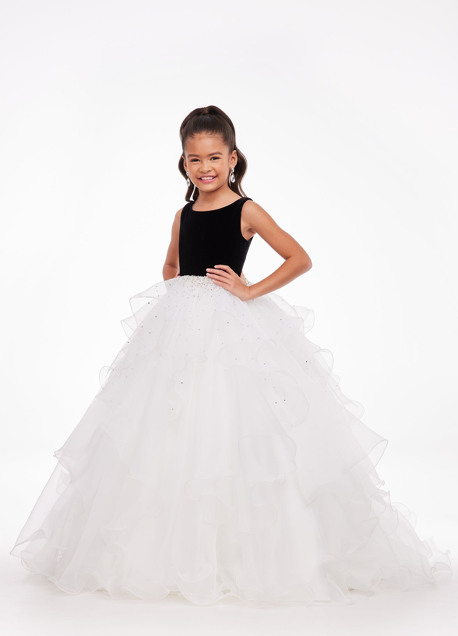 Black/Ivory ASHLEYlauren Kids 8120 elegant ball gown featuring a crew neckline, velvet bustier, beaded waistline, and cascading press-on stone details over a handkerchief organza skirt for a sophisticated and graceful look.