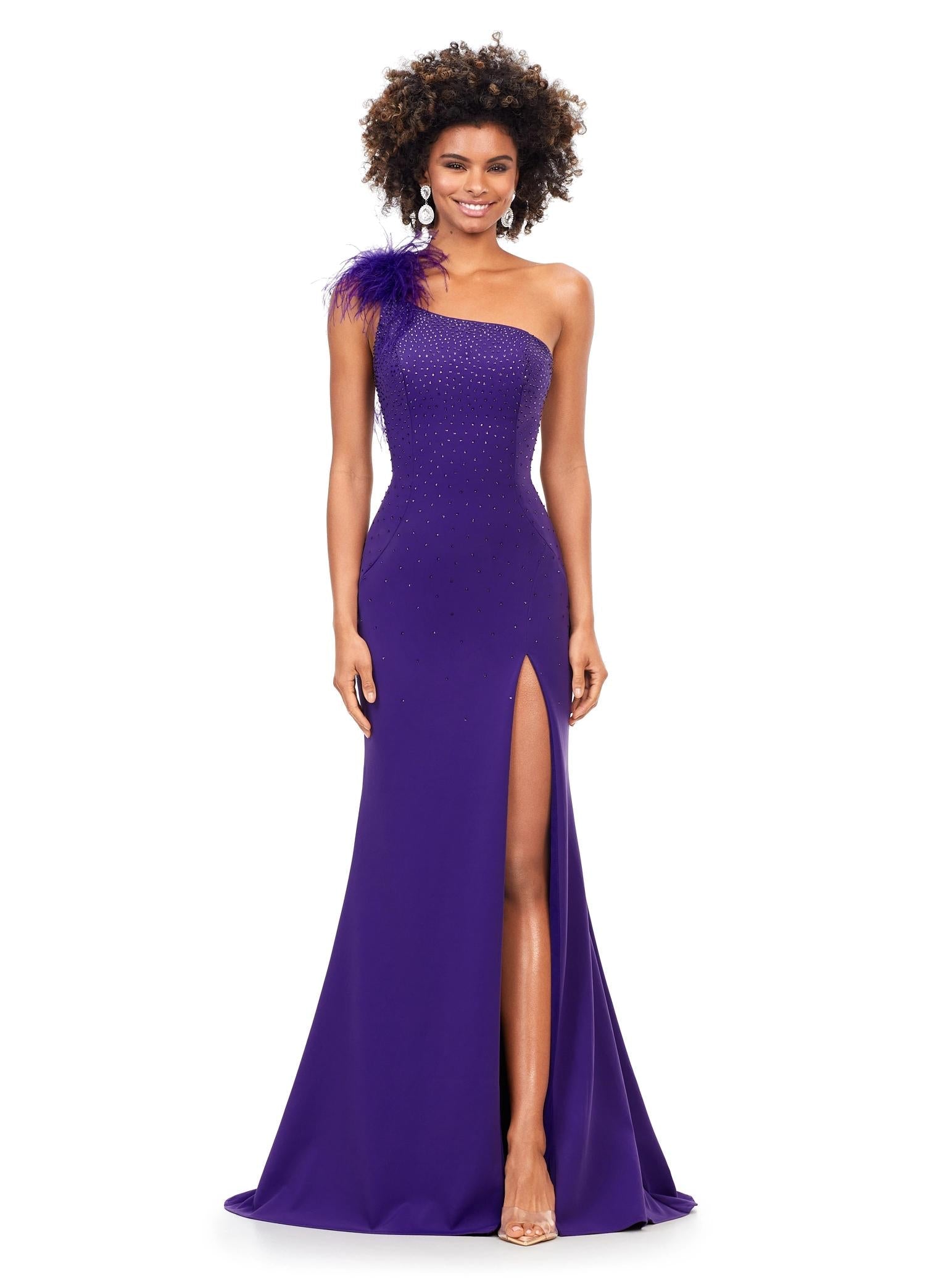 ASHLEYlauren 11290 | Orchid one shoulder gown crafted from scuba fabric, featuring feather accents at the neckline and cascading heat set stones. The left leg slit enhances the silhouette with added movement.
