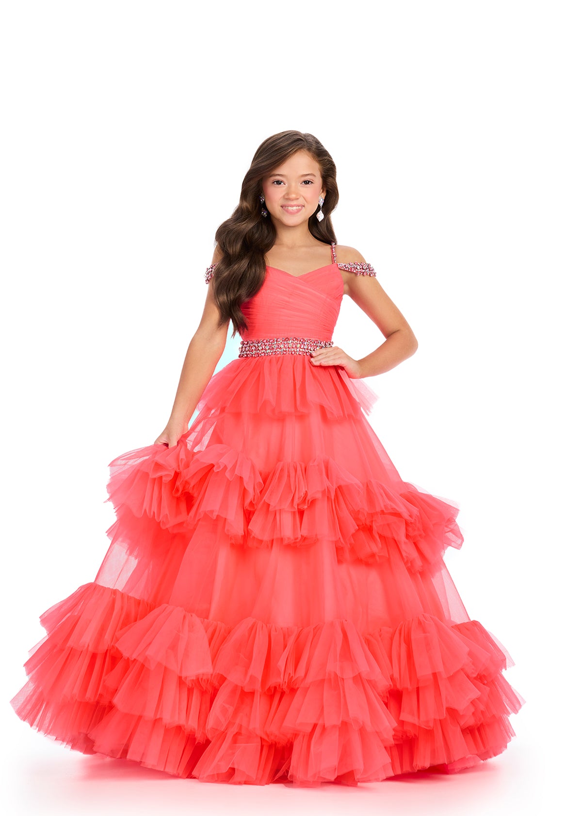 Coral ASHLEYlauren 8281 stunning tulle kids ball gown featuring an off-shoulder design, ruched bodice, crystal-encrusted straps, a beaded waistline, and a tiered skirt for a show-stopping and elegant look.