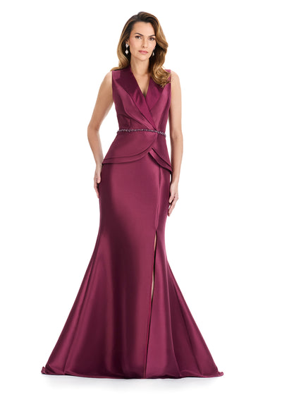 ASHLEYlauren E12131 Gown | Wine Mikado evening gown with a sleeveless lapel bodice, crystal belt, and layered peplum detail in a structured mermaid silhouette with front slit for modern sophistication.