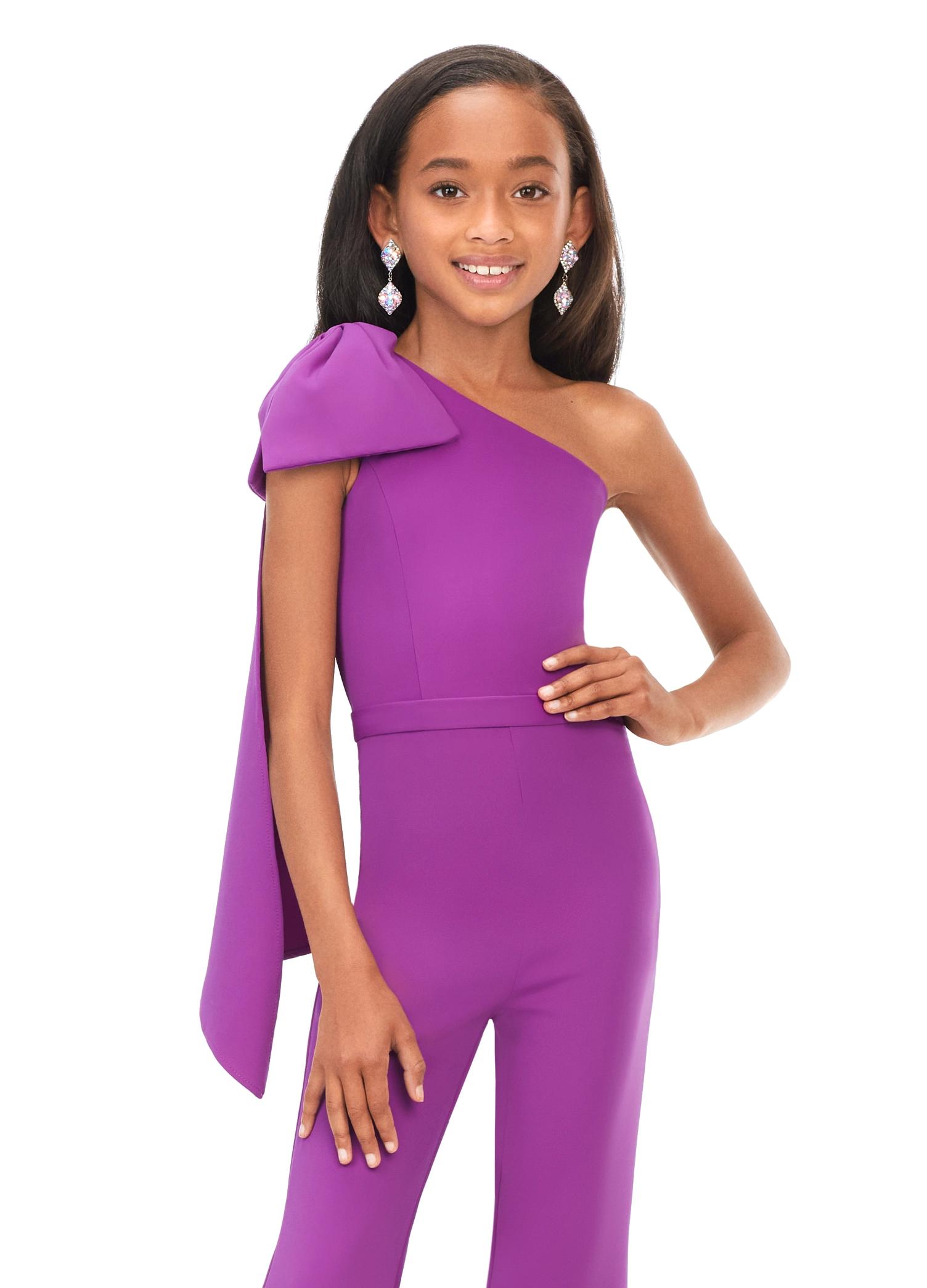 Front. Purple ASHLEYlauren Kids 8155 stylish one shoulder scuba jumpsuit featuring a statement bow with long tails on the shoulder and flare bell-bottom pants for a fun and fabulous look.