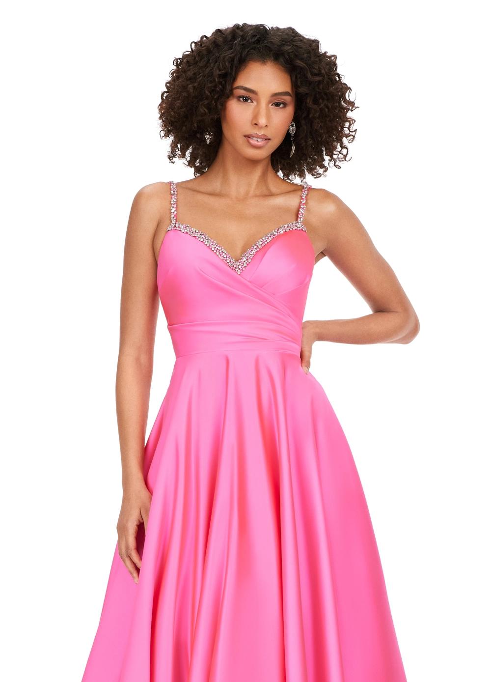 Front view. Pink ASHLEYlauren 11267 stunning A-line gown featuring delicate spaghetti straps, a sweetheart neckline, eye-catching crystal trim, and asymmetrical ruching on the bustier to accentuate your curves for a glamorous and sophisticated look.