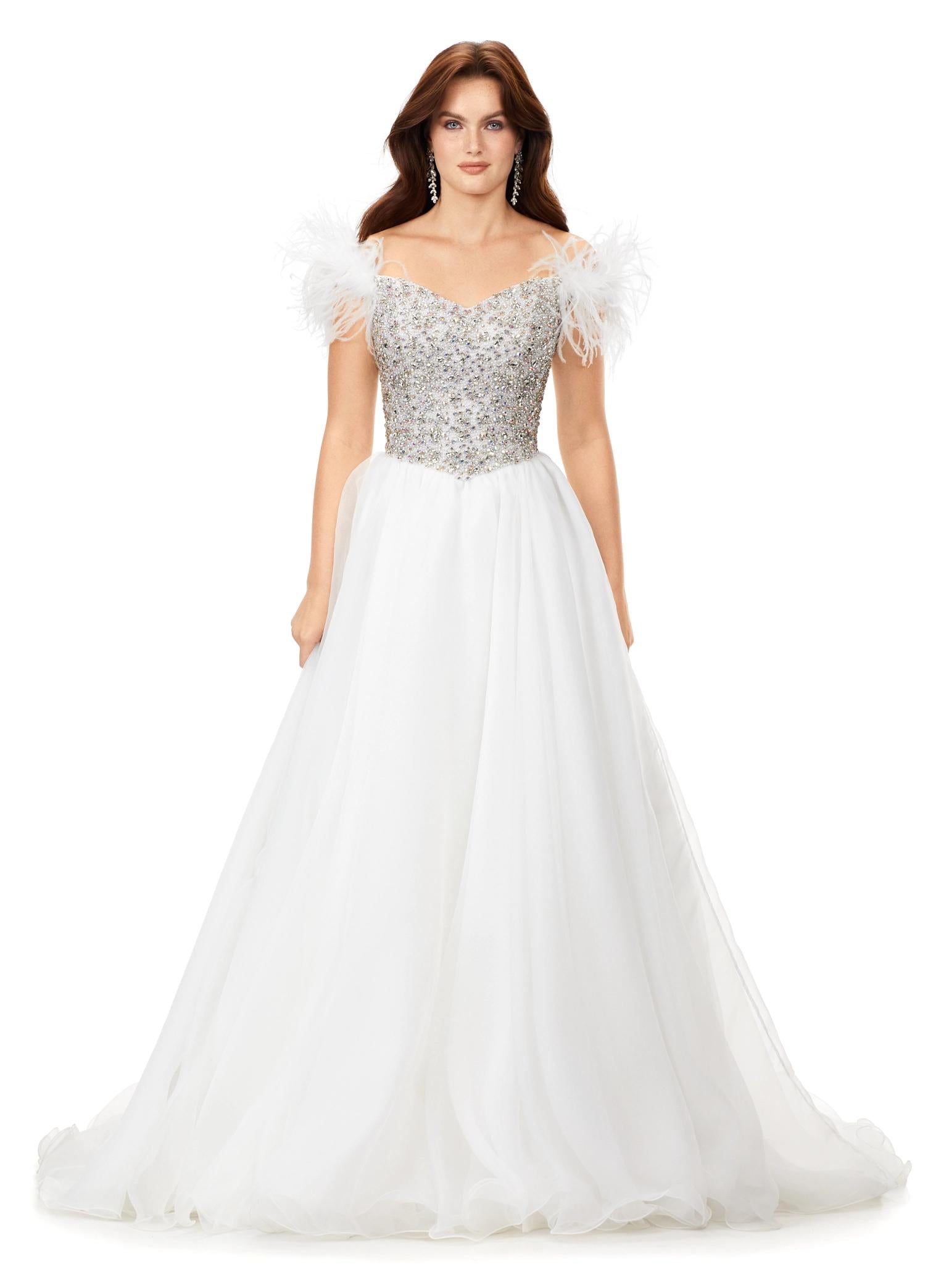 Ivory ASHLEYlauren 11314 off shoulder gown featuring feather straps, a crystal-encrusted bustier, and a flowing organza A-line skirt with wire hem.