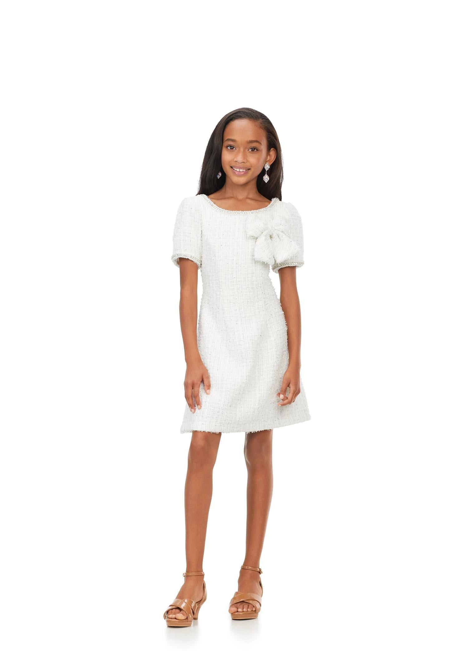 Ivory ASHLEYlauren Kids 8172 multi tweed cocktail dress featuring a crew neckline, short sleeves trimmed with pearls and crystals, and a beautiful bow detail on the bodice for a chic and elegant look.