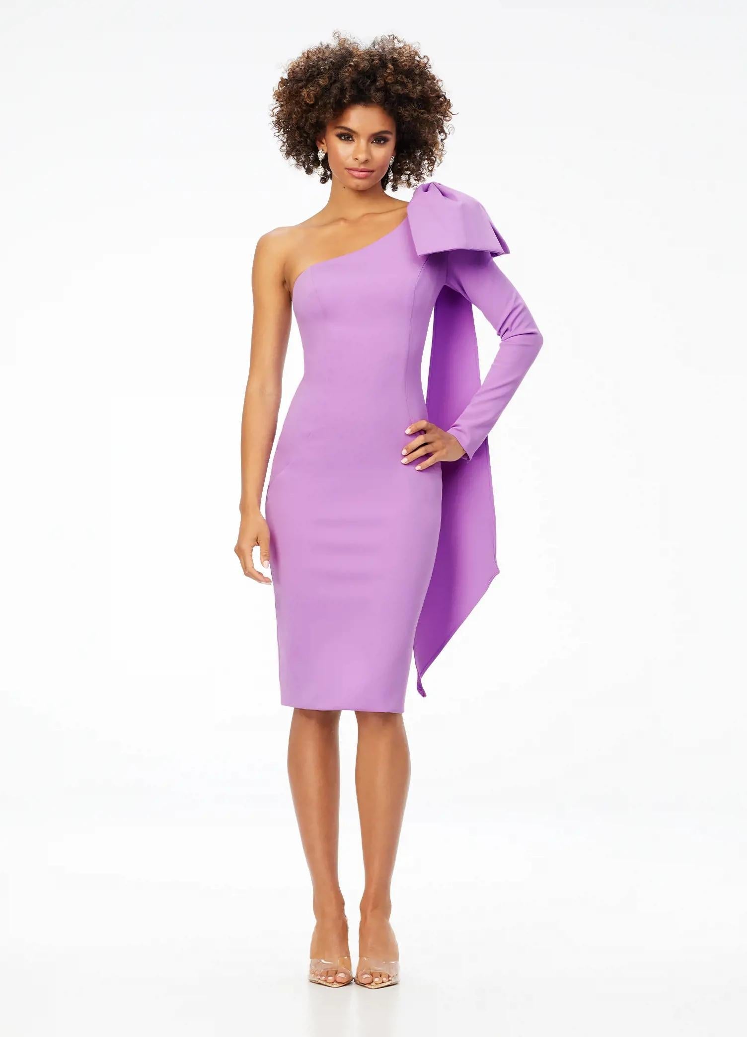 Lilac ASHLEYlauren 4480 one shoulder scuba cocktail dress featuring a single sleeve, elegant bow detail, and trailing bow tails for a sophisticated and stylish finish.