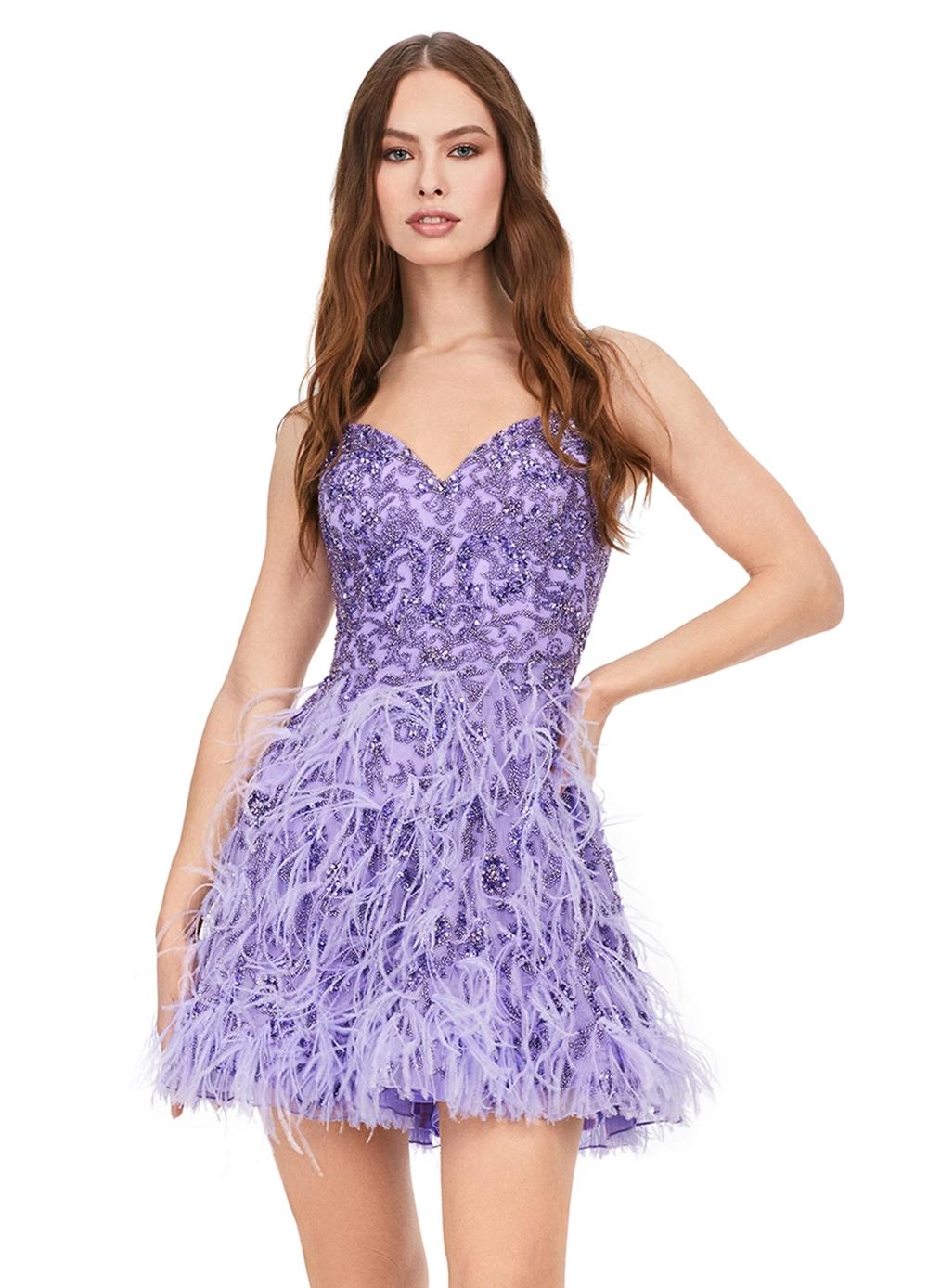 Lilac ASHLEYlauren 4604 – A fabulous cocktail dress featuring intricate beading throughout, a sweetheart neckline, spaghetti straps, and an A-line skirt adorned with feather details. Perfect for turning heads on the dance floor or stage.
