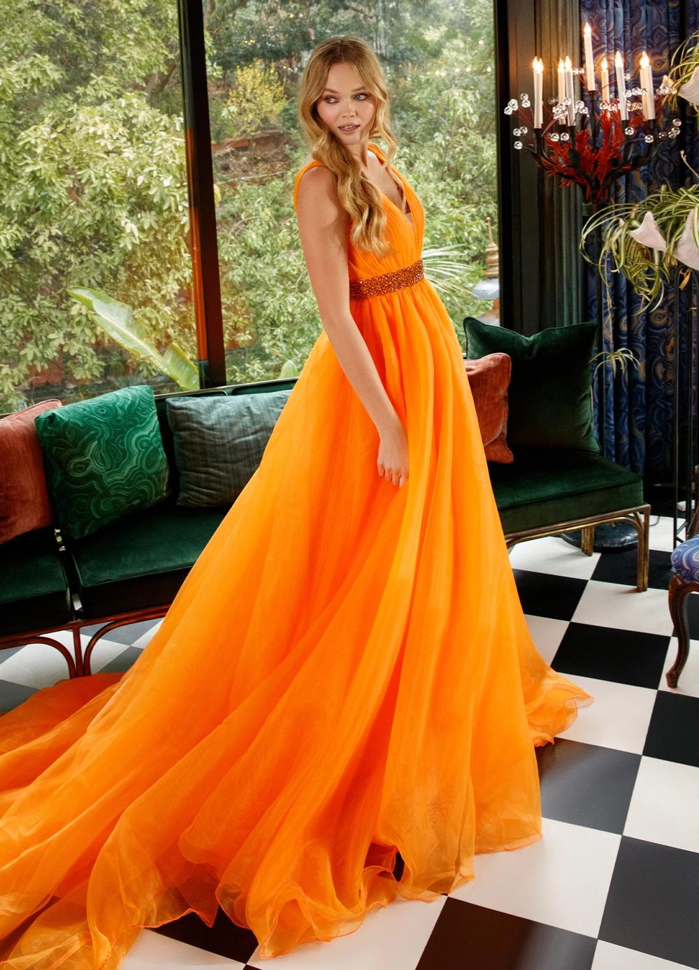Orange ASHLEYlauren 11305 stunning organza ball gown featuring a deep V-neckline, V-back, crystal-encrusted waistband, and a long, lavish train for an elegant and show-stopping look.
