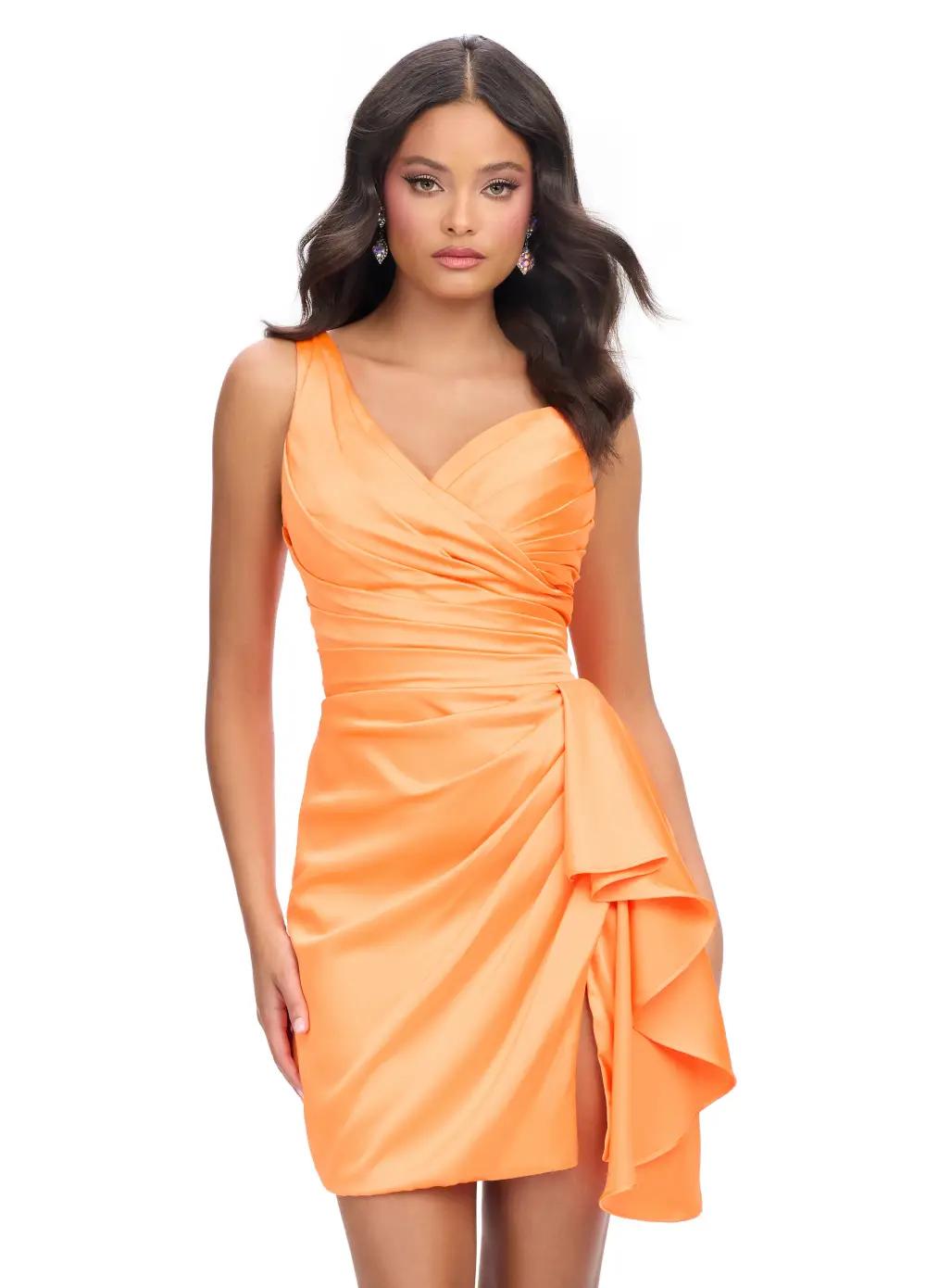 Orange ASHLEYlauren 4597 one shoulder satin cocktail dress featuring a sweetheart neckline, ruching throughout, a ruffle detail down the hip, and a wrap skirt for a timeless yet modern look.
