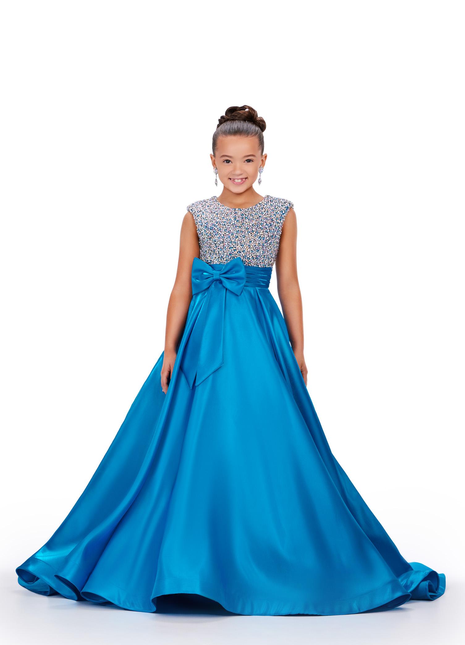 Peacock ASHLEYlauren 8247 adorable kids ball gown featuring a fully embellished cap sleeve bodice, ruched waistline, and a full satin skirt accented with a bow for a charming and elegant look.
