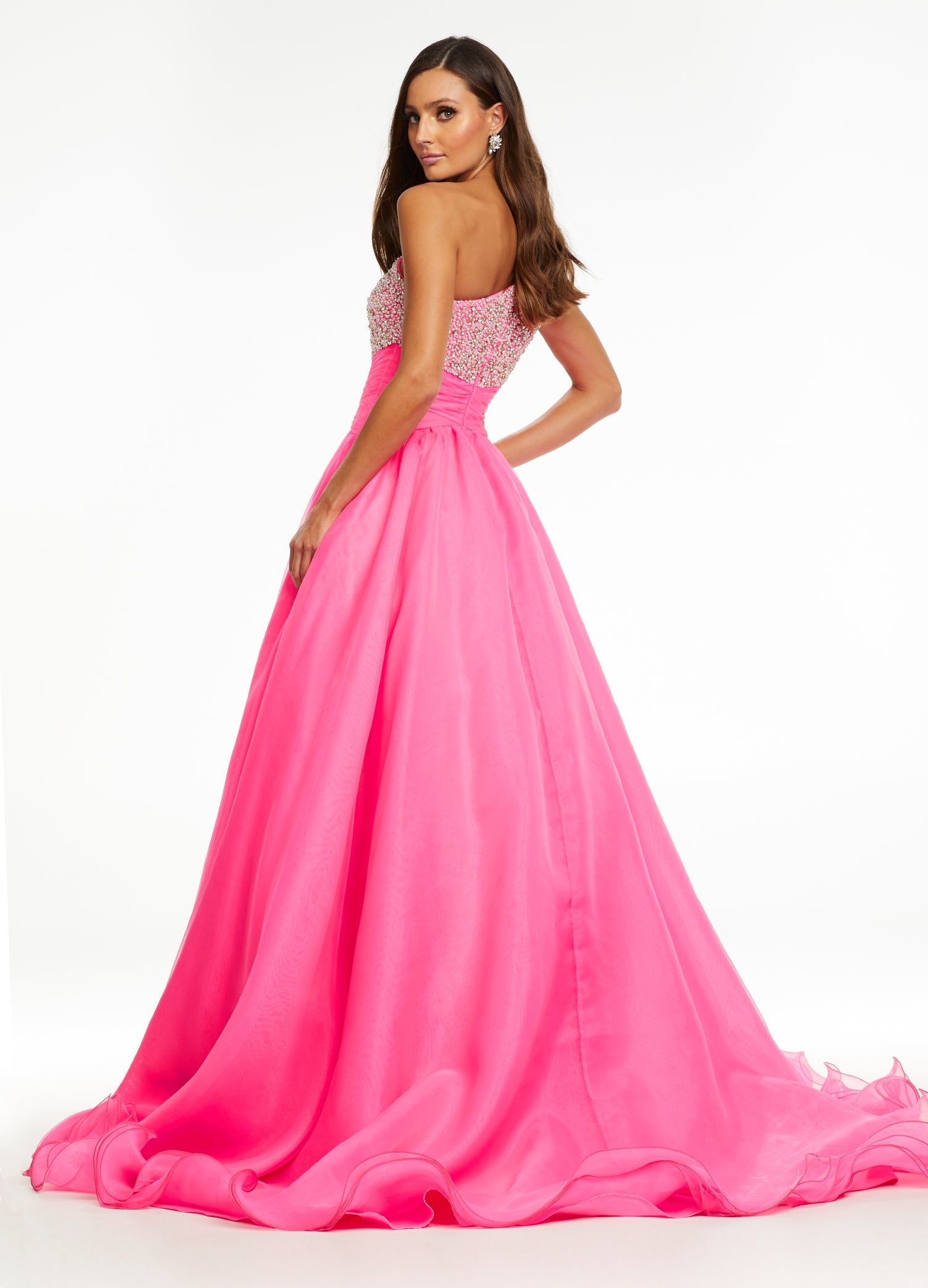 Back - Pink ASHLEYlauren 11127 – An elegant one-shoulder organza ball gown featuring an encrusted crystal and pearl detail bustier, a ruched wrap waist for a flattering silhouette, and a full ball gown skirt. Perfect for any formal event.