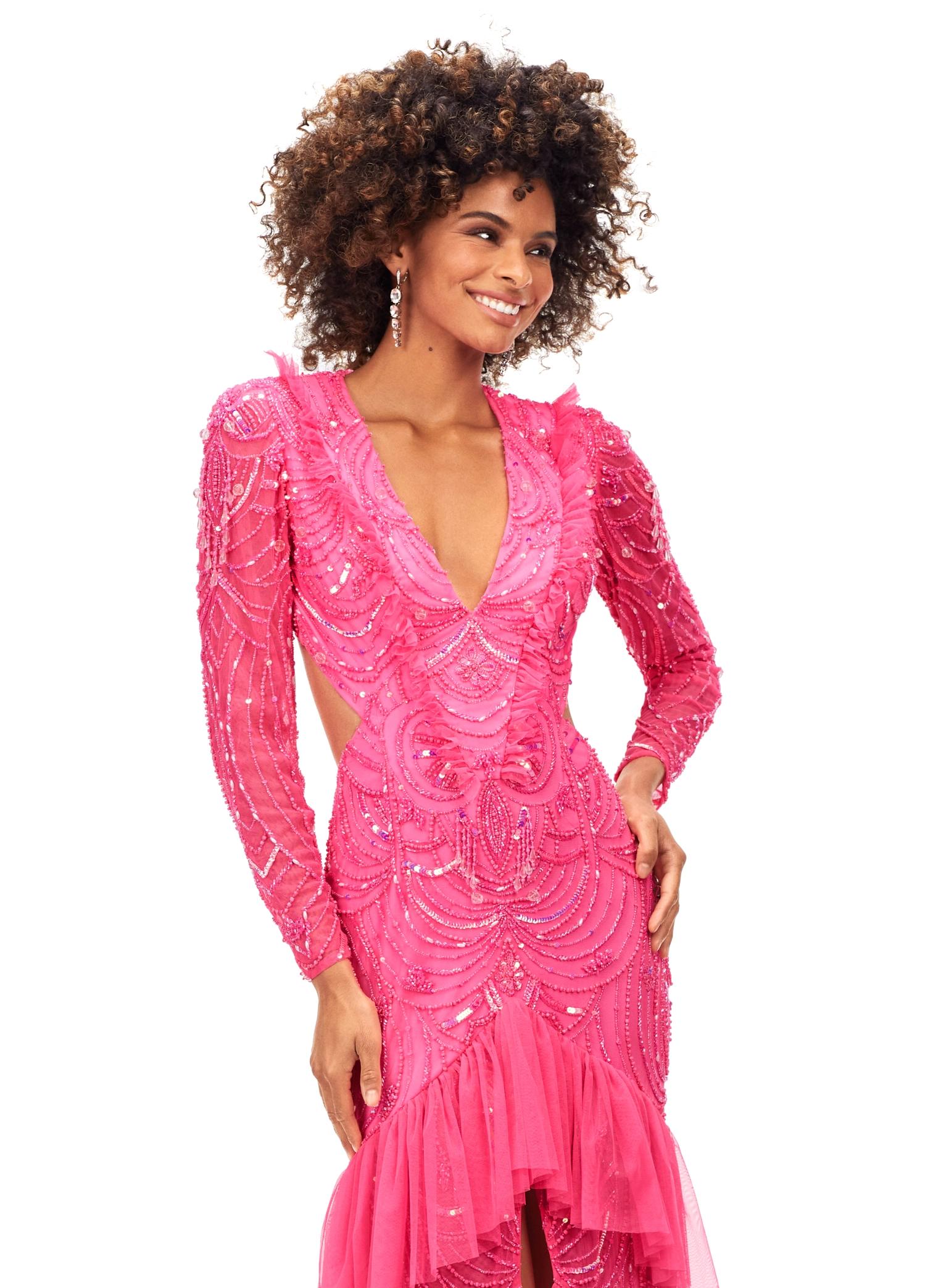 Pink ASHLEYlauren 11199 – A dramatic v-neck beaded gown featuring long sleeves, ruffle accents, a center slit, and a sweep train. Perfect for making a bold and elegant statement at any special event.



