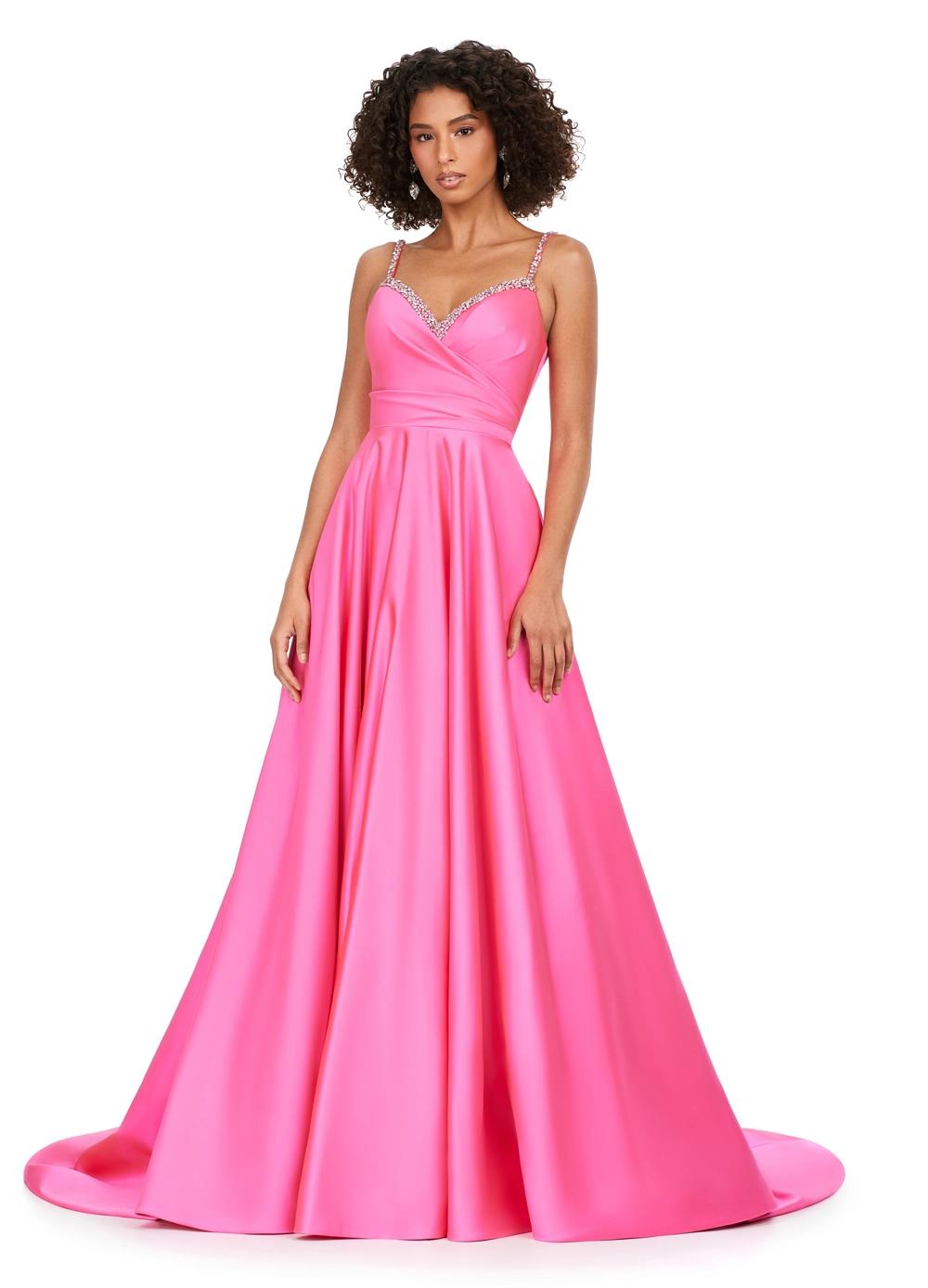 Pink ASHLEYlauren 11267 stunning A-line gown featuring delicate spaghetti straps, a sweetheart neckline, eye-catching crystal trim, and asymmetrical ruching on the bustier to accentuate your curves for a glamorous and sophisticated look.