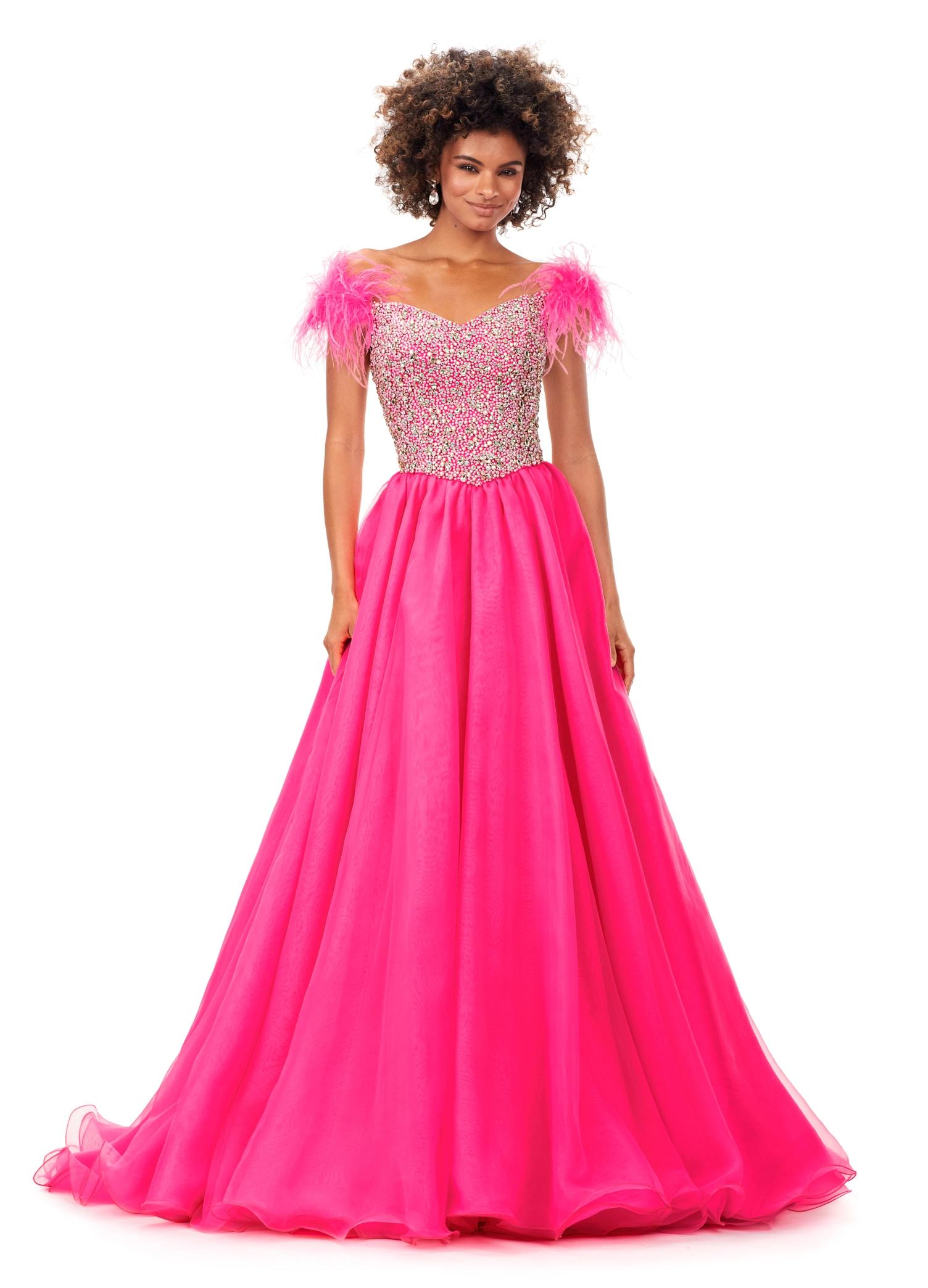 Pink ASHLEYlauren 11314 off shoulder gown featuring feather straps, a crystal-encrusted bustier, and a flowing organza A-line skirt with wire hem.