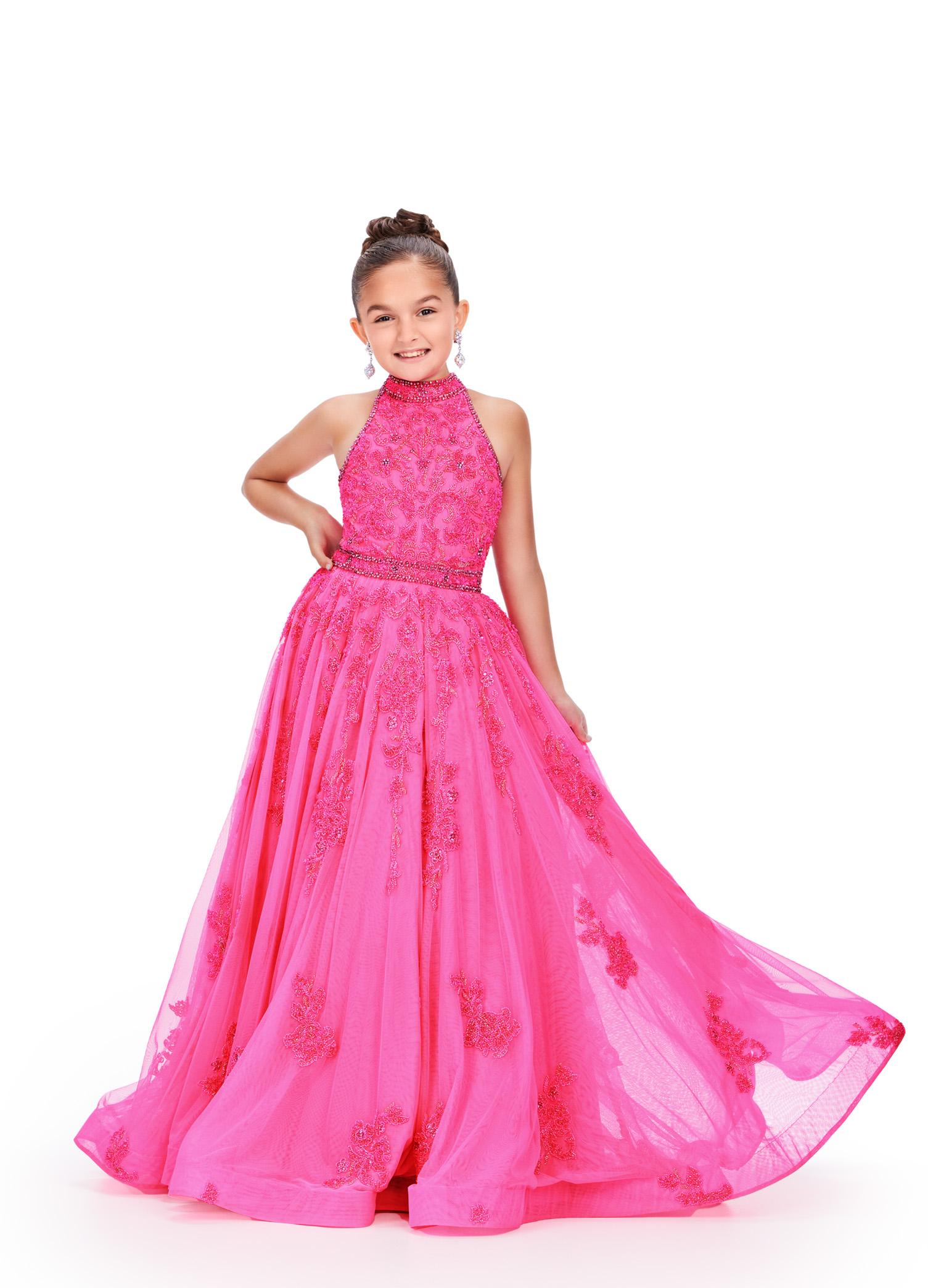 Pink ASHLEYlauren 8238 kids ball gown featuring a halter neckline, ornately beaded bodice, crystal beaded waistline, and scattered beaded appliques cascading down the A-line skirt for a glamorous and elegant look.