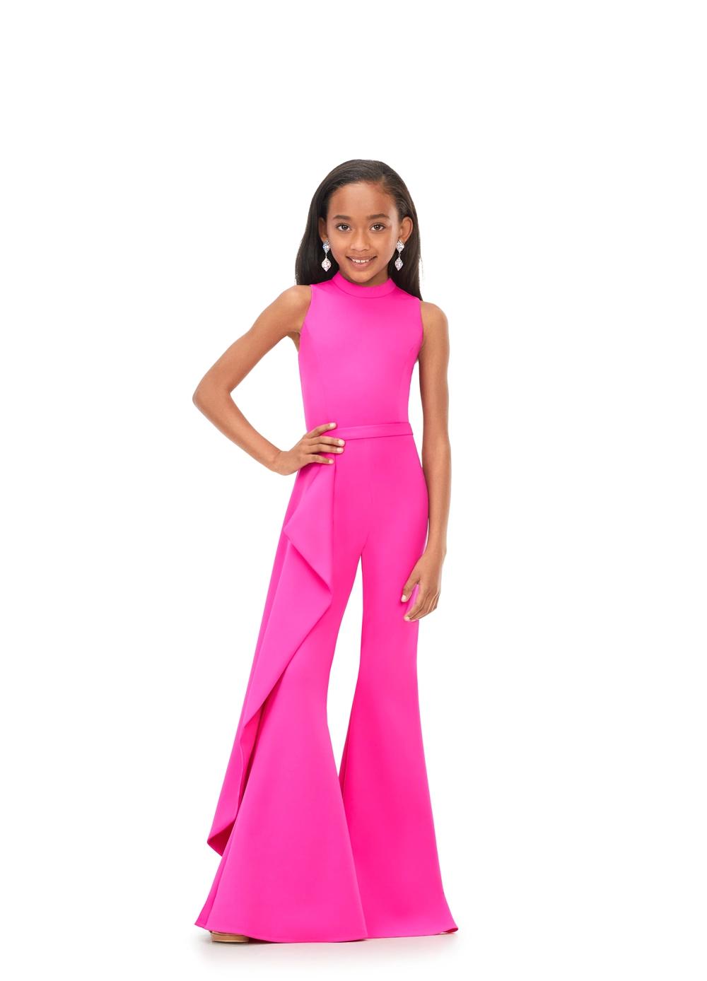 Pink ASHLEYlauren Kids 8158 fun and stylish scuba jumpsuit featuring a high crew neckline, dramatic cascading ruffle accent down the leg, and flare pants for a bold and fabulous look.