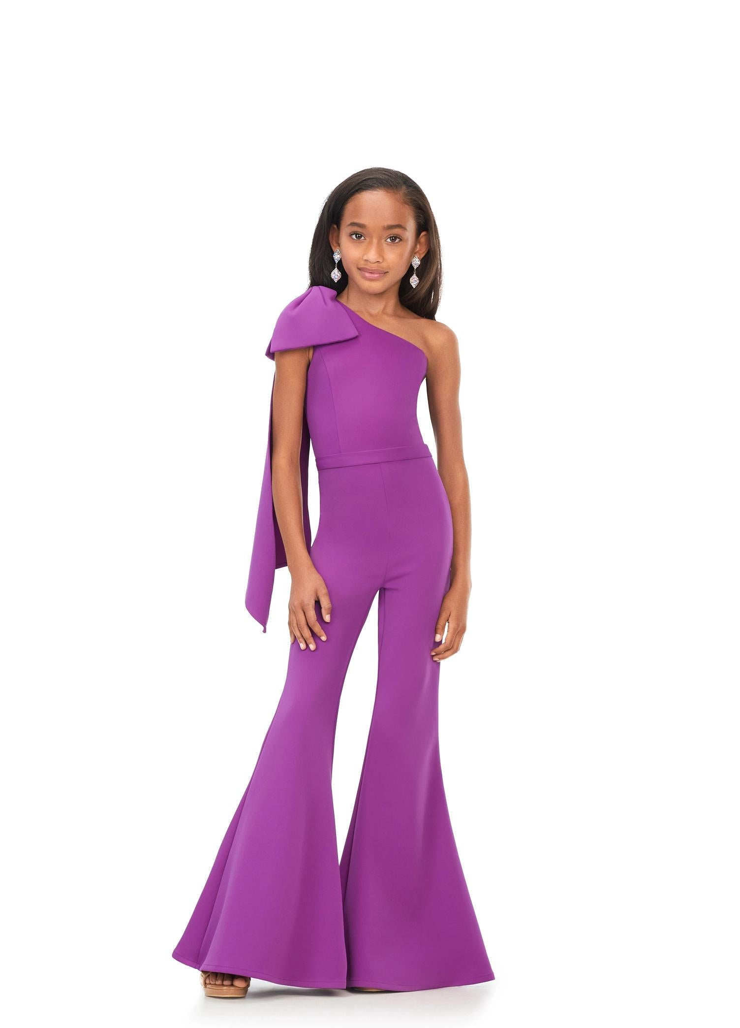 Purple ASHLEYlauren Kids 8155 stylish one shoulder scuba jumpsuit featuring a statement bow with long tails on the shoulder and flare bell-bottom pants for a fun and fabulous look.