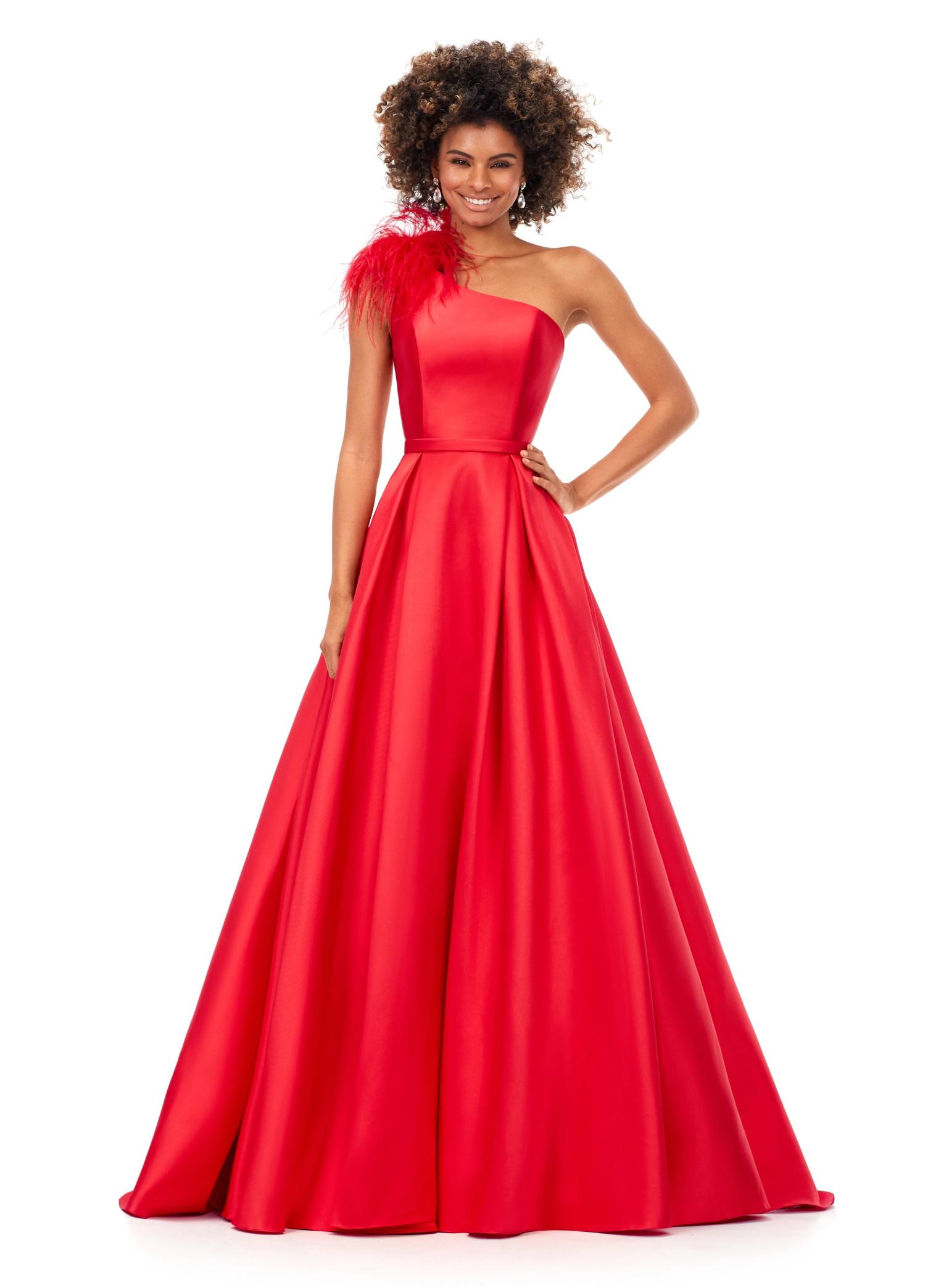 Red ASHLEYlauren 11336 one shoulder ball gown in Mikado fabric, featuring feather-embellished neckline and a classic A-line skirt.