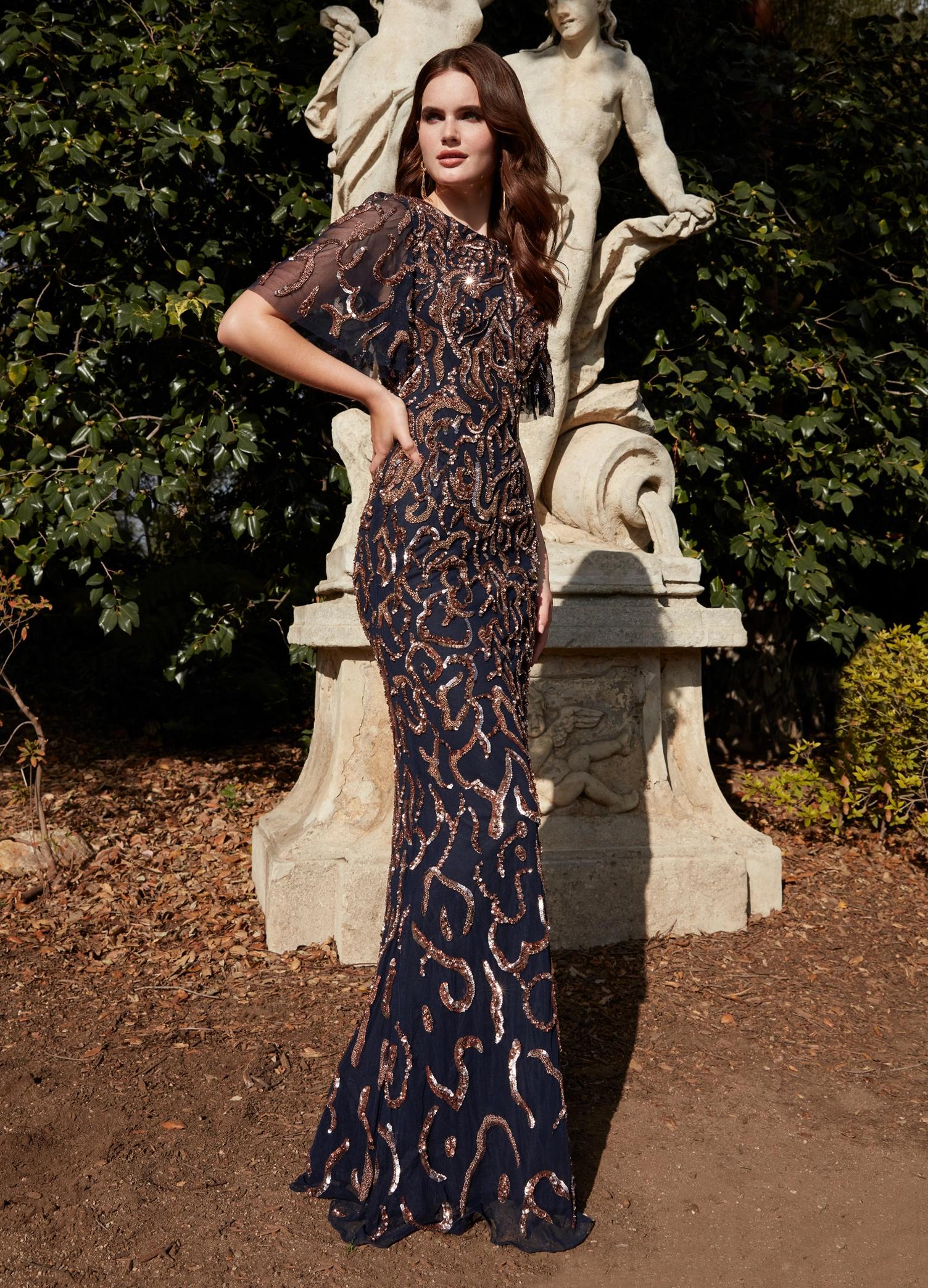 Rose Gold/Navy ASHLEYlauren 11216 Elegant Fully Hand Beaded Gown with Crew Neckline, Flowing Butterfly Sleeves, Intricate Sequin Beading, and Keyhole Back Detail