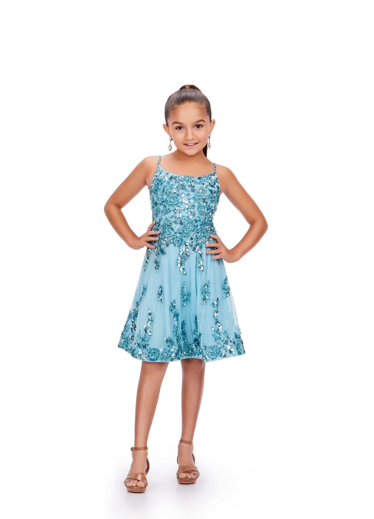 Sky ASHLEYlauren 8228 fun and flowy cocktail dress featuring delicate spaghetti straps, an intricate bead pattern cascading down the A-line skirt, and a lace-up back for a flattering and adjustable fit.
