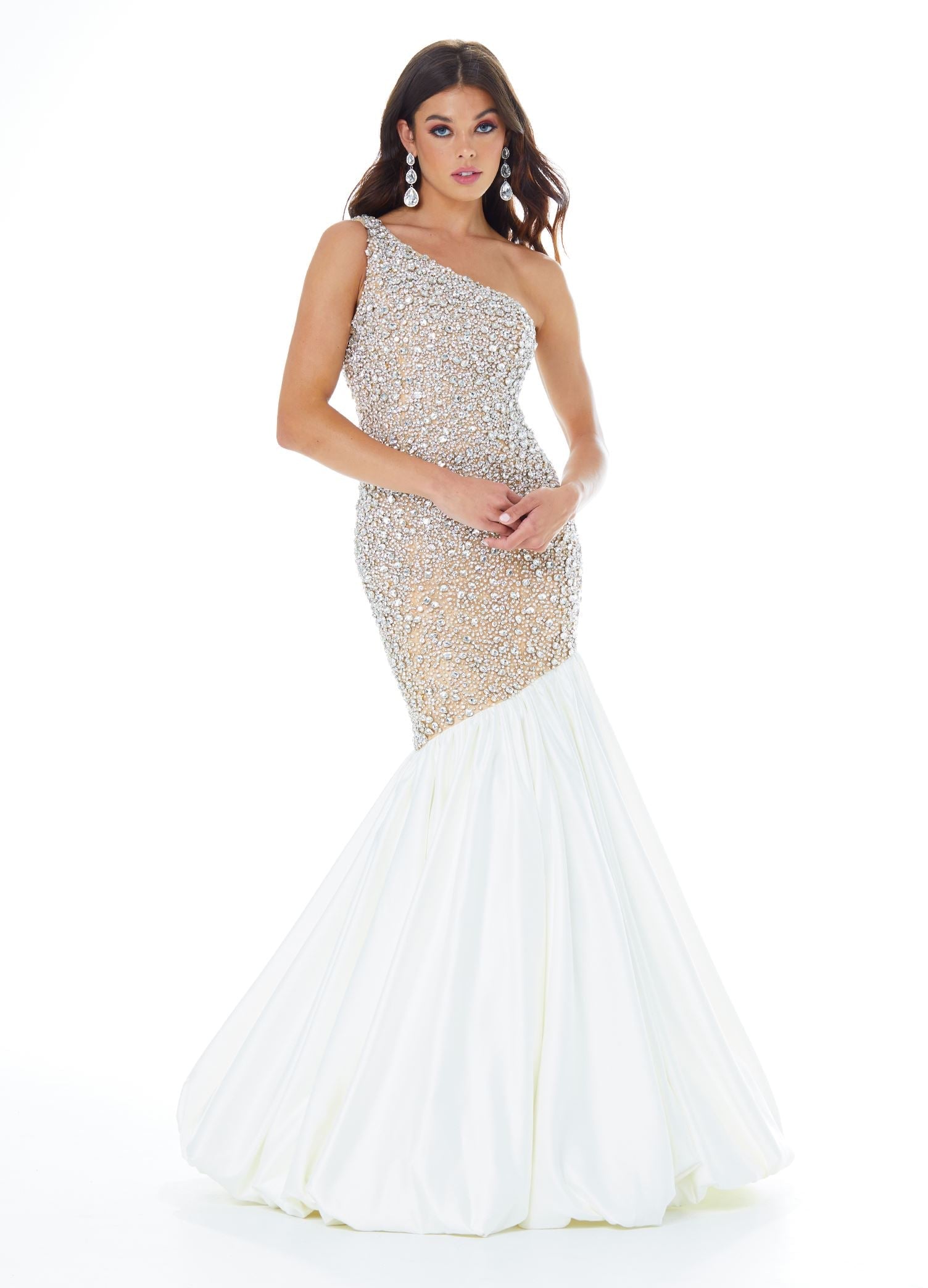 White  ASHLEYlauren 1981 – A stunning one-shoulder fit and flare gown featuring a fully crystal and pearl beaded bodice, accented by an asymmetrical satin drop skirt with a dramatic bubble hem. Perfect for making a show-stopping statement.