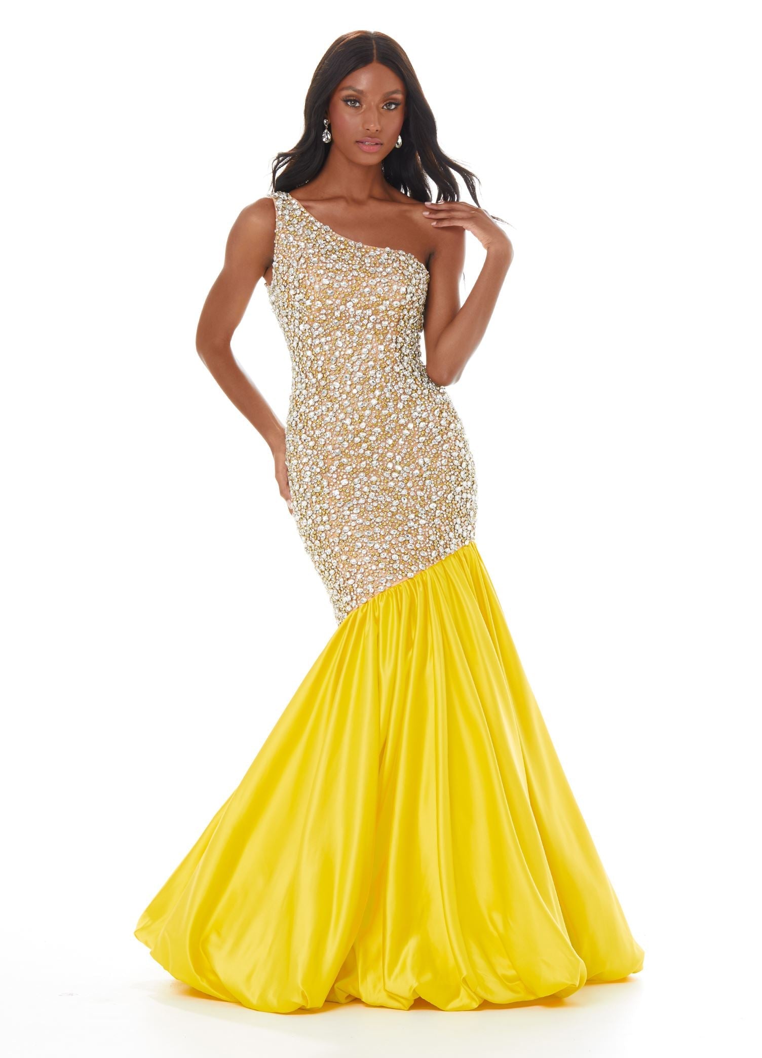 Yellow  ASHLEYlauren 1981 – A stunning one-shoulder fit and flare gown featuring a fully crystal and pearl beaded bodice, accented by an asymmetrical satin drop skirt with a dramatic bubble hem. Perfect for making a show-stopping statement.