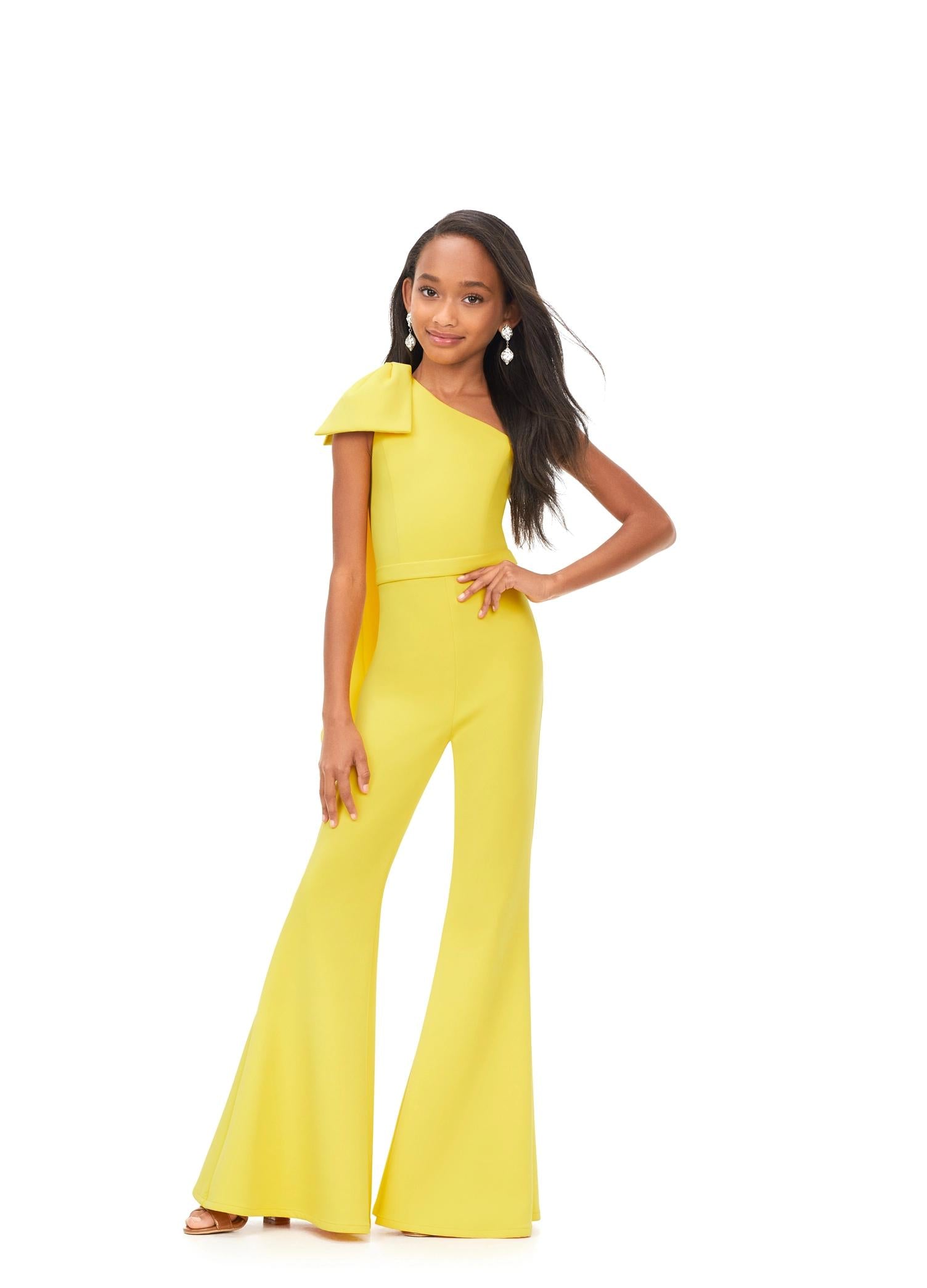 Yellow ASHLEYlauren Kids 8155 stylish one shoulder scuba jumpsuit featuring a statement bow with long tails on the shoulder and flare bell-bottom pants for a fun and fabulous look.