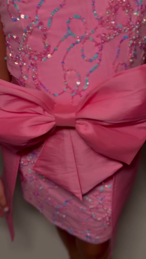 Video - ASHLEYlauren 8266 kids cocktail dress featuring a crew neckline, intricately beaded bow pattern, V-back, and a removable taffeta overskirt with an oversized bow for a charming and elegant look.