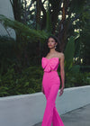 ASHLEYlauren 12291 | Hot Pink two piece scuba jumpsuit with strapless oversized bow top, high waisted flare pants, and sleek modern silhouette