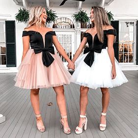 2 young models wearing short ASHLEYlauren dresses